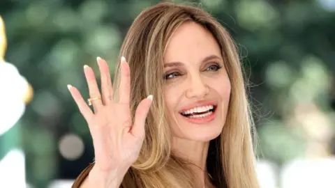 Getty Images Angelina Jolie waving