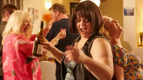 Gavin (MATHEW HORNE), Pam (ALISON STEADMAN), Smithy (JAMES CORDEN), Nessa (RUTH JONES), Stacey (JOANNA PAGE) partying in the finale of Gavin & Stacey