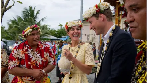 Getty Images William and Kate drinking from a coconut in Tuvalu in 2012