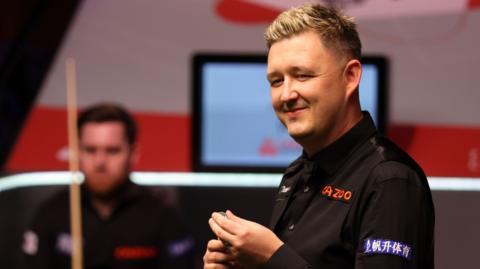 Kyren Wilson smiles during the World Championship final