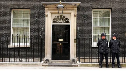 Getty Images Two police officers stand outside No 10 Downing Street