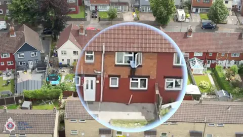 Man jumping from bedroom window of house