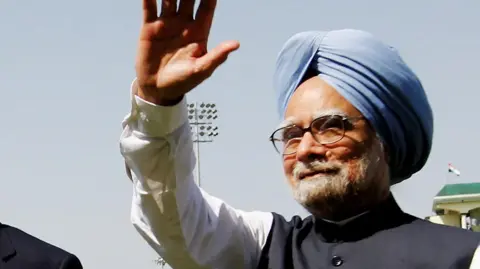 File photo of former prime minister Manmohan Singh, seen waiving to a crowd outside the frame of the photo