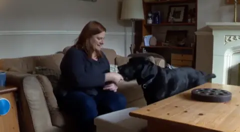 Ms Hall and her assistance dog, Sailor