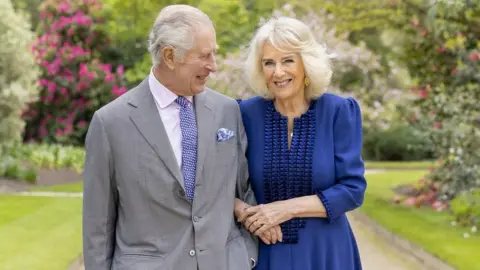 Millie Pilkington/Buckingham Palace/PA King Charles and Queen Camilla in Buckingham Palace gardens to mark their 19th wedding anniversary