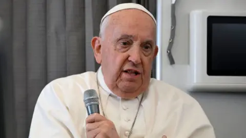  Pope Francis speaks with journalists aboard the return flight from Singapore 