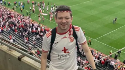 Cahir O'Hagan in football top in stadium