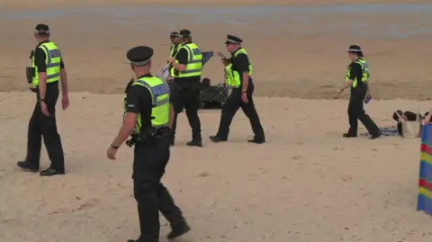 Police on Fistral beach in Newquay