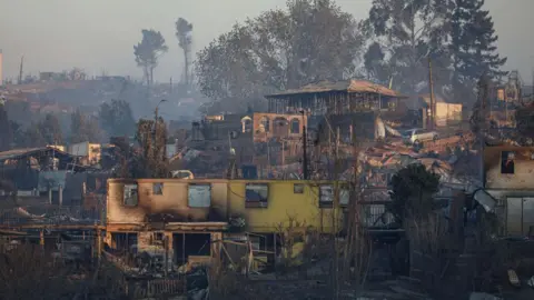  A view of damage as houses are destroyed after a forest fire that affected the hills of Vina del Mar, Chile, on February 3, 2024.