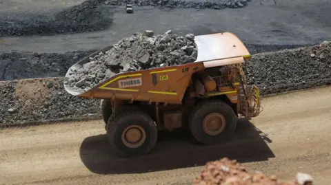 Getty Images Lithium ore being transported from a mine in Western Australia