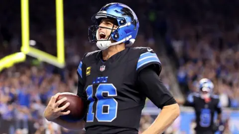 Jared Goff celebrating after throwing a touchdown pass