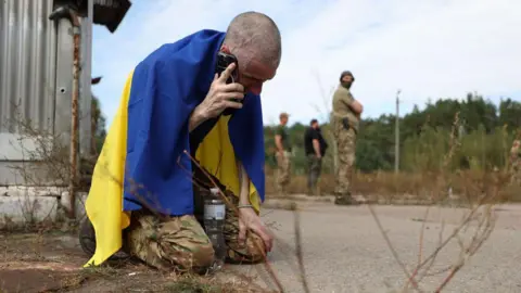 Getty Images Ukrainian soldier calls home after release from Russian captivity