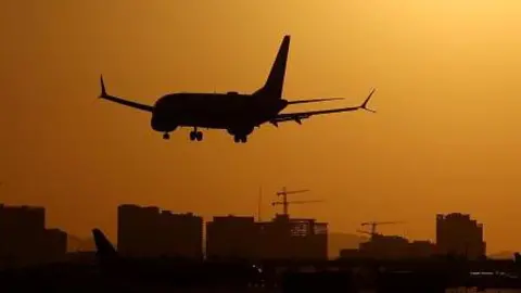 A plane lands at Phoenix Sky Harbor International Airport  in Phoenix, Arizona