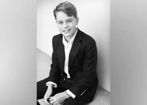 Kensington Palace Black and white photo of Prince George in shirt and suit