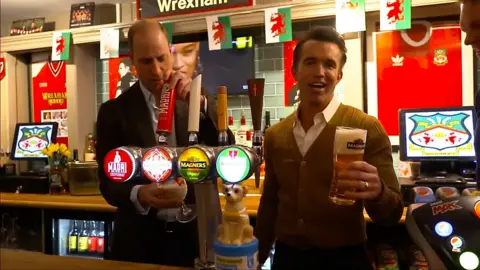 Prince William behind a bar with Rob McElhenney