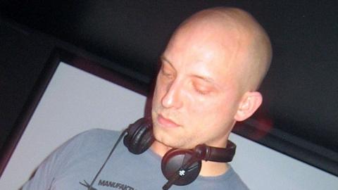 Tomcraft wearing headphones on stage in 2007