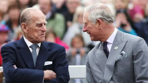  Andrew Matthews / PA The Duke of Edinburgh (left) and the Prince of Wales, during a visit to Poundbury, a new urban development on the edge of Dorchester, October 2016