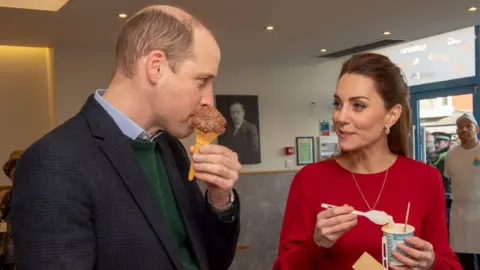 Getty Images Prince William and Catherine, eat ice cream during a visit to Joe's Ice Cream Parlour in Mumbles on 4 February 2020