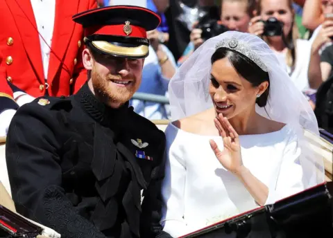 PA Prince Harry, Duke of Sussex and the Duchess of Sussex in the Ascot Landau carriage during the procession after getting married