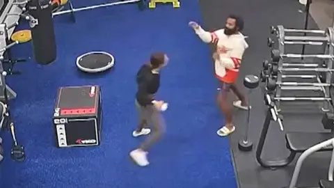 Woman flees man in gym