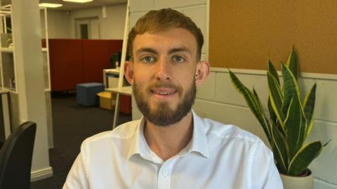 man in office in white shirt 