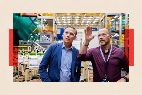 Reuters Boeing's new CEO Kelly Ortberg being shown around the plant, wearing safety glasses