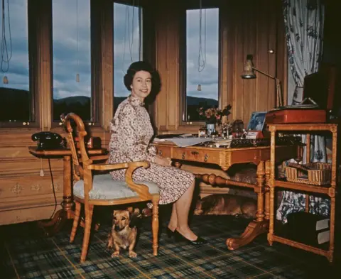 Getty The Queen at the writing desk in her study at Balmoral in 1972