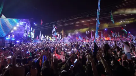 PA Media Huge crowd watches Coldplay's performance at Glastonbury 