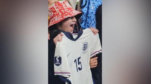 Poppy after receiving Millie Bright's England shirt