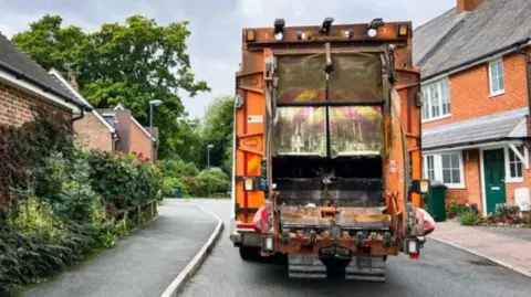 A refuse lorry in a street