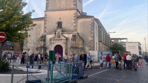 BBC People queue to vote