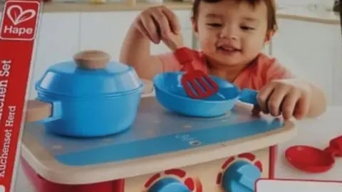 A box for a toddler's kitchen set which had contained succulents