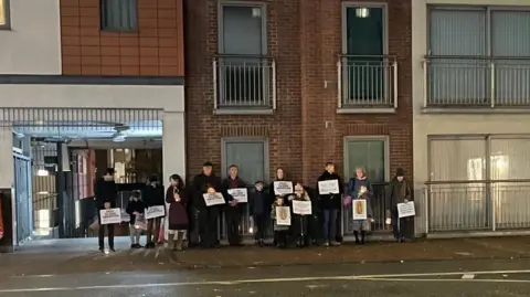 LDRS A previous pro-life vigil opposite the BPAS clinic in London Street, Reading (faces pixelized to protect the identities of children). Several people stand holding placards.