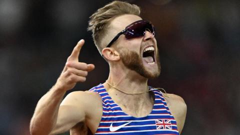 Josh Kerr celebrates winning world 1500m gold in Budapest