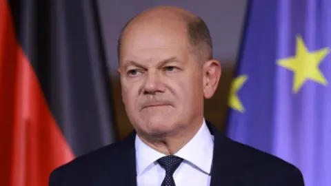 Germany's chancellor Olaf Scholz is trying to hold together a minority government after his coalition collapsed