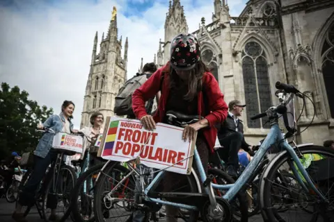 Supporters of the left-wing Popular Front on a bike rally in Bordeaux - 3 July