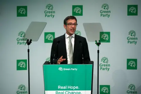 Green Party co-leader Adrian Ramsay addressing his party's conference in Manchester