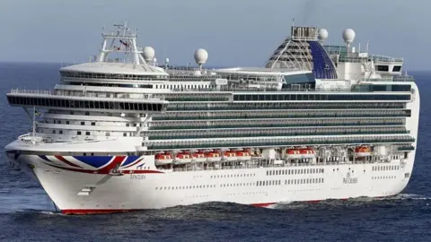 Getty Images Ventura cruise ship sailing at sea. It has a union flag painted on its side.