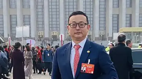 Yang Tengbo outside a CCP party gathering in Beijing at an unknown date