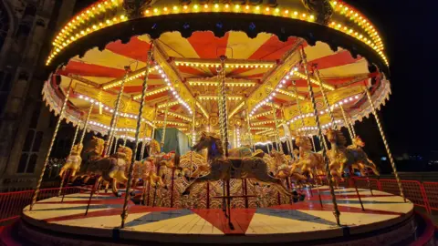 BBC Weather Watchers/Whethertheweatherbefine A carousel at night