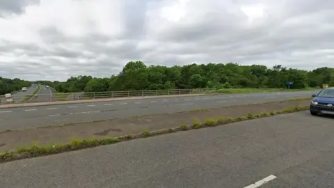 A bridge which had a concrete verge in the middle of its six lanes going over the M5 motorway.