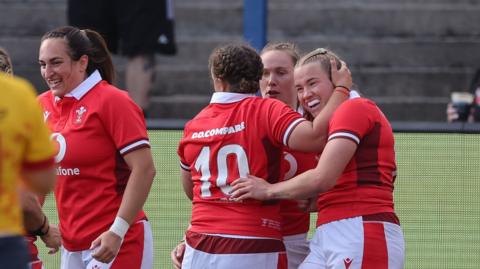 Carys Cox of Wales celebrates with Lleucu George of Wales after scoring a try against Spain