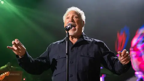 Getty Images Tom Jones on stage singing