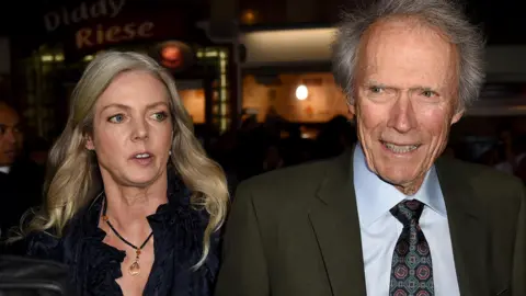 A picture of Christina Sandera (L) and Clint Eastwood 