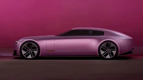 Matte pink luxury car shining under the lights