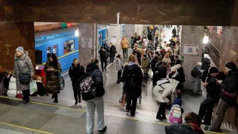 Getty Images An image of a Metro station in Dnipro with people sheltering inside