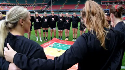 Wales women huddle at a captain's run