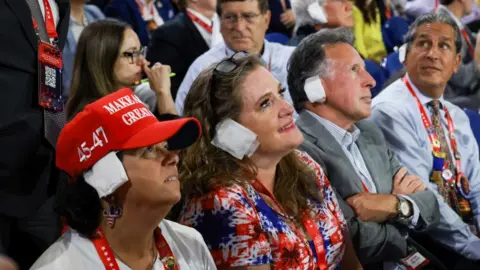 Trump supporters wear white ear bandages in support of Donald Trump in Milwakee on 17 July