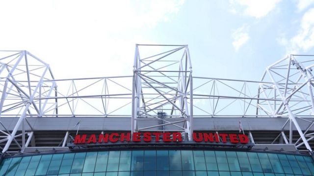 The Manchester United sign on the outside of Old Trafford