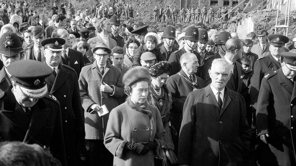 The Queen on the site of Pantglas Junior School, on her right is Councillor Jim Williams, who lost seven members of his family